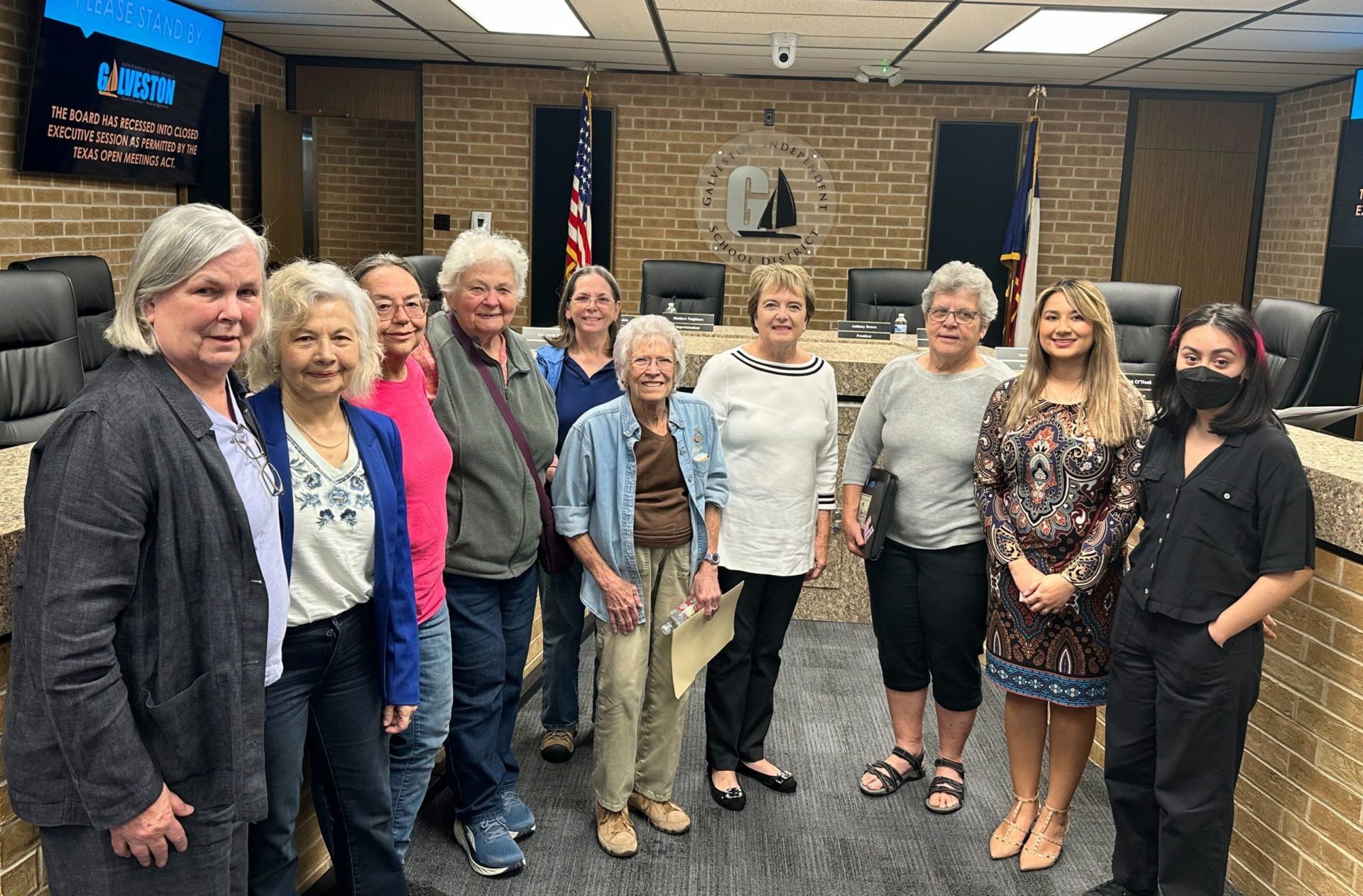 A group of public education advocates at a Galveston ISD school board meeting