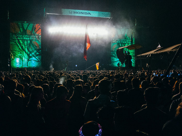 Crowd in front of a main stage at Austin City Limits Music Festival at night